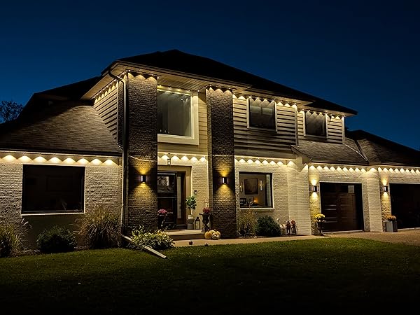 Asahom Permanent Outdoor Lights Pro installed along a home's roofline and eaves at night